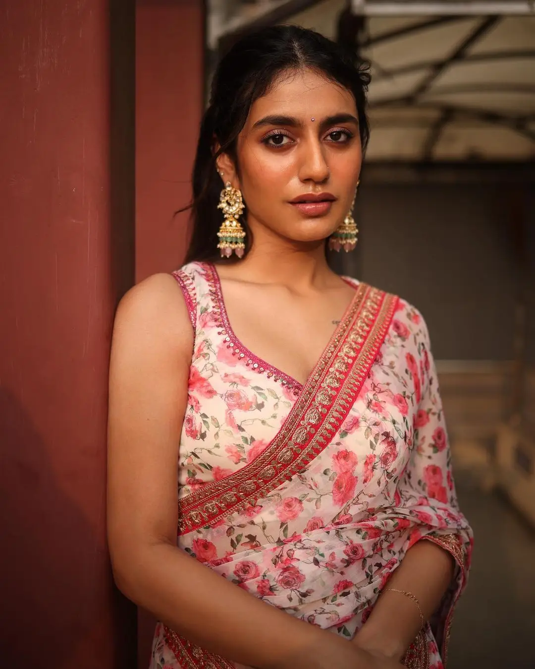 PRIYA PRAKASH VARRIER STILLS IN RED SAREE SLEEVELESS BLOUSE